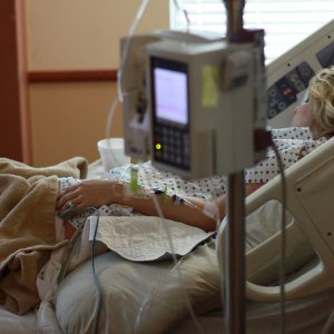 Patient in bed with PCA to IV